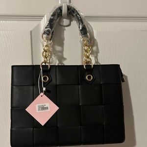 Black purse with gold hardware